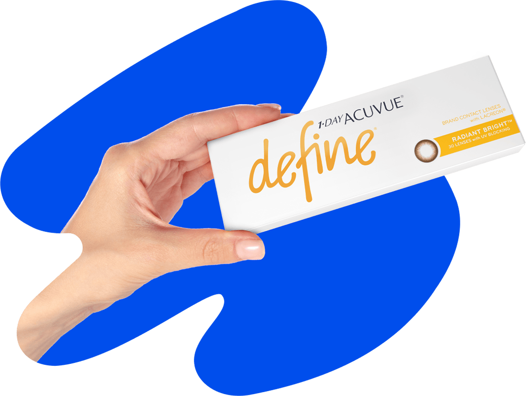 A hand holding up a box of Acuvue Define® Classic